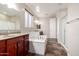 Luxurious bathroom with a soaking tub, double vanities, and a separate shower, offering a spa-like experience at 12029 W Overlin Ln, Avondale, AZ 85323