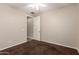 Bedroom with neutral carpeting and a door leading to another room at 12029 W Overlin Ln, Avondale, AZ 85323
