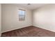 The bedroom includes soft carpet, neutral walls, and a window with light filtering blinds at 12029 W Overlin Ln, Avondale, AZ 85323