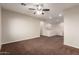 Large carpeted bonus room includes neutral walls, and view of second story railing at 12029 W Overlin Ln, Avondale, AZ 85323