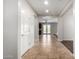 Spacious entryway featuring tile floors, leading to a bright living area with a ceiling fan and patio access at 12029 W Overlin Ln, Avondale, AZ 85323