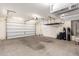 Well-organized garage with storage racks, a garage door, and ample space for parking and projects at 12029 W Overlin Ln, Avondale, AZ 85323