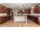 Spacious kitchen featuring ample counter space, modern appliances, and a center island at 12029 W Overlin Ln, Avondale, AZ 85323