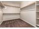 Walk-in closet with built-in shelving at 12029 W Overlin Ln, Avondale, AZ 85323
