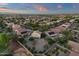 Aerial view of a residential neighborhood with well-maintained homes and lush green landscaping at 14267 W Crocus Dr, Surprise, AZ 85379