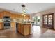 Spacious kitchen featuring granite countertops, stainless steel appliances, and ample cabinet space at 14267 W Crocus Dr, Surprise, AZ 85379