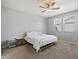 Bedroom with neutral walls and carpet, ceiling fan and lots of natural light at 15070 W Garfield St, Goodyear, AZ 85338