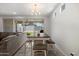 Dining room features a stylish table and chairs with backyard views at 15070 W Garfield St, Goodyear, AZ 85338