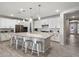 Spacious kitchen features a large island, modern appliances, and sleek countertops at 15070 W Garfield St, Goodyear, AZ 85338