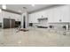 Well-equipped kitchen offers a granite countertop, ample storage, and stainless steel appliances at 15070 W Garfield St, Goodyear, AZ 85338