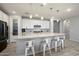 Open kitchen features a large island with seating, perfect for entertaining guests at 15070 W Garfield St, Goodyear, AZ 85338