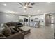 The kitchen and living room showcase a bright and airy space perfect for relaxing at 15070 W Garfield St, Goodyear, AZ 85338