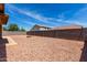Spacious backyard with rock landscaping and a cozy fire pit area for outdoor relaxation at 16147 W Central St, Surprise, AZ 85374
