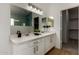 Bright bathroom boasts double sinks, plenty of counter space, and stylish modern fixtures at 16147 W Central St, Surprise, AZ 85374