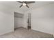 Clean, carpeted bedroom with a walk-in closet and neutral walls; perfect for relaxation at 16147 W Central St, Surprise, AZ 85374