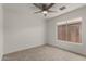 Well-lit bedroom with plush carpet and large window providing lots of natural light at 16147 W Central St, Surprise, AZ 85374