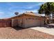 Side view of the house, highlighting the two-car garage and desert landscaping at 16147 W Central St, Surprise, AZ 85374