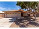 Charming home with a two-car garage, desert landscaping, and a tile roof at 16147 W Central St, Surprise, AZ 85374