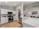 Bright kitchen with stainless steel appliances, white cabinets, and a spacious breakfast bar at 16147 W Central St, Surprise, AZ 85374
