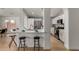 Modern kitchen features breakfast bar with seating, stainless steel appliances, and tile backsplash at 16147 W Central St, Surprise, AZ 85374