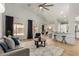 Bright living room with wood floors, modern ceiling fan and views of the backyard at 16147 W Central St, Surprise, AZ 85374