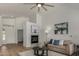 Bright living room with fireplace, wood floors, modern decor, and comfortable seating at 16147 W Central St, Surprise, AZ 85374