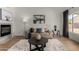 Cozy living room with fireplace, plush rug, comfortable seating, and modern decor at 16147 W Central St, Surprise, AZ 85374