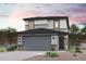 Beautiful two-story home featuring a two-car garage and desert landscaping at 17360 W Jessie Ln, Surprise, AZ 85387