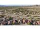 An aerial view of a desert community with single-story homes and native vegetation at 17562 W Desert Sage Dr, Goodyear, AZ 85338