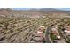 An aerial view of a residential neighborhood nestled in the desert landscape at 17562 W Desert Sage Dr, Goodyear, AZ 85338