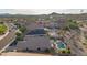 Desert homes with private pools, tile roofs, and solar panels in an established neighborhood at 17562 W Desert Sage Dr, Goodyear, AZ 85338
