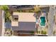 Bird's eye view of backyard oasis, desert landscaping and neighboring homes at 17562 W Desert Sage Dr, Goodyear, AZ 85338