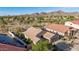 Aerial view of desert homes with pools and mountain views in the background at 17562 W Desert Sage Dr, Goodyear, AZ 85338