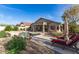 Expansive backyard featuring a private pool, covered patio, and lush desert landscaping for outdoor living at 17562 W Desert Sage Dr, Goodyear, AZ 85338