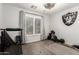 Versatile bedroom space with gym equipment, large window, and sporty décor for fitness enthusiasts at 17562 W Desert Sage Dr, Goodyear, AZ 85338