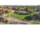 The community park offers a green space and playground surrounded by desert landscaping at 17562 W Desert Sage Dr, Goodyear, AZ 85338