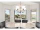 Bright dining room features a view of the pool and backyard at 17562 W Desert Sage Dr, Goodyear, AZ 85338