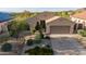 Charming single-story home with desert landscaping, two car garage, and paved driveway at 17562 W Desert Sage Dr, Goodyear, AZ 85338