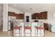 Kitchen with breakfast bar and seating with stainless steel appliances at 17562 W Desert Sage Dr, Goodyear, AZ 85338