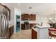 Spacious kitchen and breakfast bar, with stainless steel appliances at 17562 W Desert Sage Dr, Goodyear, AZ 85338