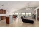 Bright, open floor plan with a living room, dining area, and kitchen, seamlessly blending living spaces at 17562 W Desert Sage Dr, Goodyear, AZ 85338
