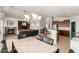 Open-concept living space combines dining, living, and kitchen areas, perfect for modern living and entertaining at 17562 W Desert Sage Dr, Goodyear, AZ 85338