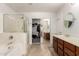 Main bathroom featuring dual sinks, and a glass enclosed shower at 17562 W Desert Sage Dr, Goodyear, AZ 85338