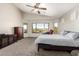 Main bedroom with vaulted ceiling and large windows at 17562 W Desert Sage Dr, Goodyear, AZ 85338