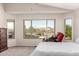 Main bedroom with vaulted ceiling and backyard views at 17562 W Desert Sage Dr, Goodyear, AZ 85338