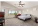 Spacious main bedroom with vaulted ceiling and relaxing backyard views at 17562 W Desert Sage Dr, Goodyear, AZ 85338