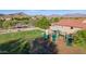 The neighborhood playground features slides and other fun equipment, and a grassy area at 17562 W Desert Sage Dr, Goodyear, AZ 85338