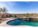 Sparkling pool with desert views and lounge chairs create a relaxing backyard oasis at 17562 W Desert Sage Dr, Goodyear, AZ 85338