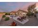 Relaxing backyard oasis with a sparkling pool, comfortable lounge chairs, and desert landscaping at 17562 W Desert Sage Dr, Goodyear, AZ 85338