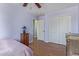 Bedroom with a ceiling fan, bed, and closet at 17851 W Calavar Rd, Surprise, AZ 85388